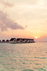 Beautiful tropical Maldives resort hotel and island with beach and sea