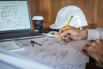 Construction engineering or architect hands working on blueprint inspection in workplace, while...