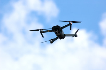 drone fly in blue cloudy sky