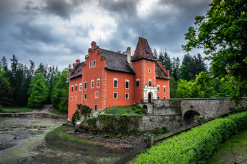 Cervena Lhota château. It stands at the middle of a lake on a rocky island. Its picturesque...