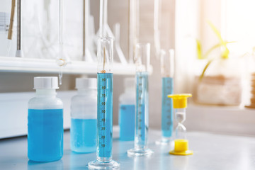 Water quality analysis in a chemical laboratory, a device for measuring pH using equipment made of glass, yellow hourglass