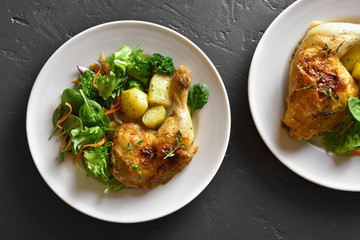 Rosted chicken leg with potato and green salad