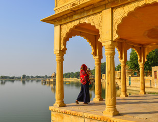 A young Indian woman looking at the lake