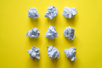 collection of various crumpled paper on yellow background