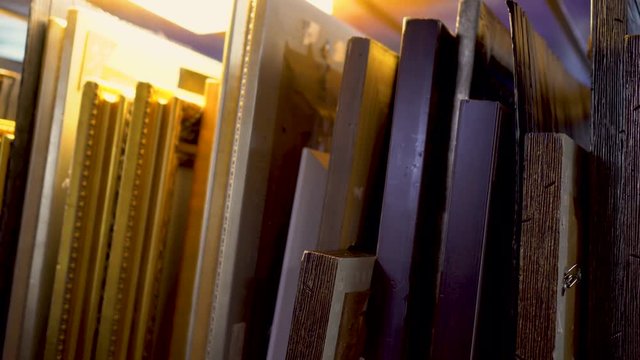 Art storage shelves storing canvas, frame and boards for painting