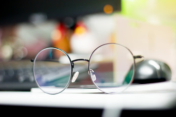 Fototapeta na wymiar Glasses on the table in office.