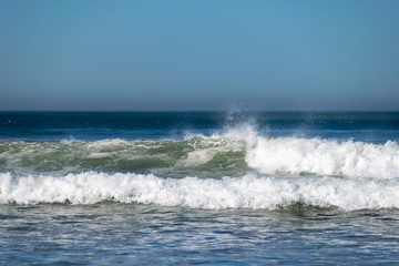 atlantic ocean waves breaking onto beach in Agadir,, Morocco