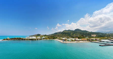 Panorama of tropical resort Amber Cove with pier for cruise ships  and resort on sunny day
