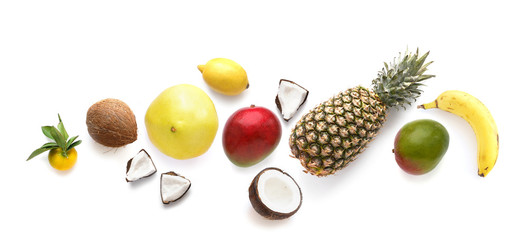 Fruits isolated on white background, top view. Creative composition of tropical fruits, flat layout.