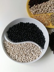 three colors of beans on a Yin Yang plate
