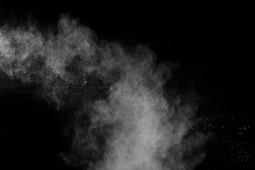 Fototapeta na wymiar White talcume powder explosion on black background.