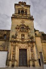 Fototapeta na wymiar Front door and bell tower of Saint Peter Church in Arcos de la Frontera Spain