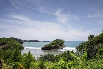 Beautiful sea wave and white sand beach landscape on asmara bay beach Malang, east java, indonesia.