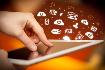 Hand holding tablet with social media concept
