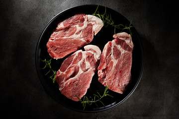 Fresh raw steak meat with rosemary