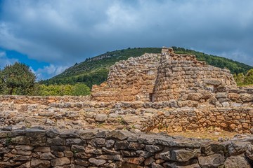 Fototapeta na wymiar Nuraghe Palmavera, Alghero, Sardinia, Italy. is an archaeological site located in the territory of Alghero, Sardinia. Built during the Bronze and the Iron Ages.