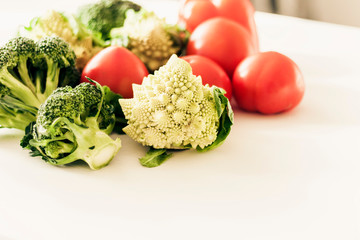 Vegetable variety on wooden white table. Selection of summer and autumn vegetables, space for text.