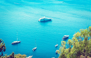 Sea view with sailboat, motor boat from Taormina, Sicily, Italy.