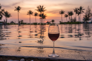 Glass of red wine at luxury beach resort