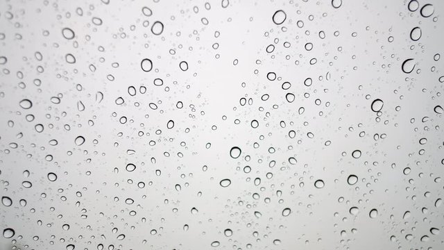Close-up of water droplets on glass . 4K.