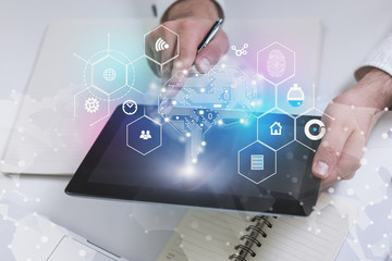 Man with tablet at table, AI concept