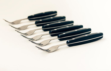 Close up six forks isolated on white background.