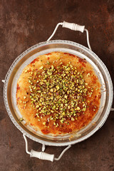 Turkish dessert kunefe, kunafa, kadayif with pistachio