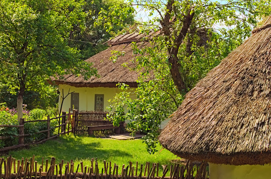 Concept of historical buildings in ancient Ukrainian village. Reconstruction of an ancient clay house with front yard and other buildings. Pereyaslav-Khmelnitsky Museum of Folk Architecture and Life