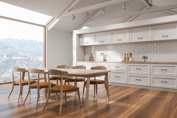 White Scandinavian kitchen corner with table