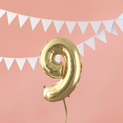 Happy 9th birthday party celebration gold balloon and bunting. 3D Render