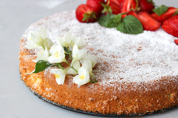 Orange cake decorated with strawberries