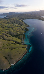 Seen from a bird's eye view, dawn breaks over scenic islands in Komodo National Park, Indonesia. This tropical area is known for its marine biodiversity as well as its dragons.