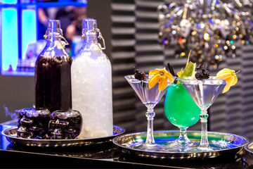 Different cocktail on top of the bar in restaurant