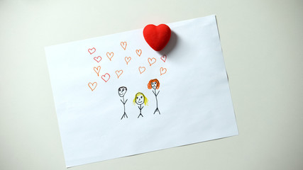 Heart sign lying on family drawing, child dreaming about love and care, adoption