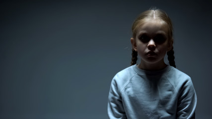 Lonely female child looking at camera, kidnapping victim, social problem