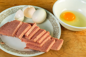 Ingredients for Spam and Egg Omelette on Vintage Cutting Board