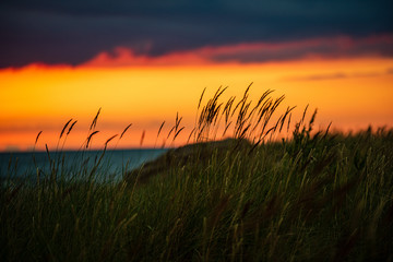 Fototapeta premium clear sky with dramatic clouds over the lake in sunset