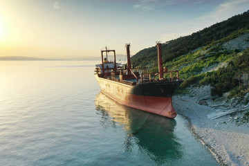 Fototapeta na wymiar Shipwreck. Dry cargo ship left on coast.