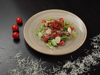Healthy salad. Salad with boiled beef, vegetables and quail eggs