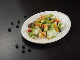 Fruity berry dessert of sliced fruit on a plate