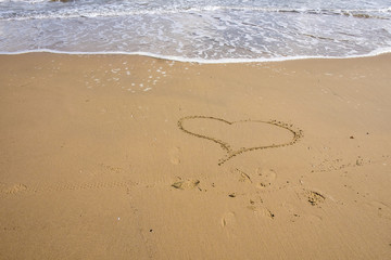 Heart in the sand of italy beach.