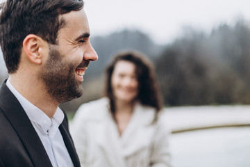 young couple of men and women during a wedding photo shoot in the mountains. Attractive bride and groom, perfect wedding couple