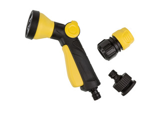 Yellow garden spray nozzle for garden hose close-up.