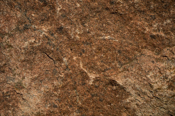 Background of natural stone. A snapshot of granite boulder (Latin 