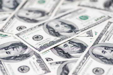 Currency US dollar banknotes close-up. Texture US dollars. Background of one hundred dollar bills