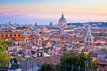Rome rooftops and landmarks colorful sunset view