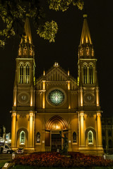 Cathedral with nocturnal illumination and streetlamps