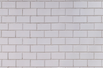 Naklejka premium Old porcelain white tiles background on the station of Budapest M1 Yellow metro line build in art nouveau style