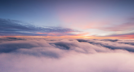 Fototapeta na wymiar Sunset sky with beautiful clouds from the airplane window