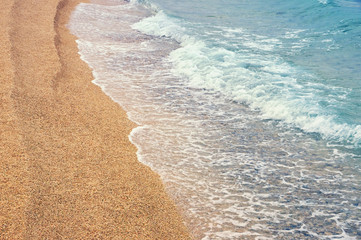 Sandy beach, background. Montenegro, Adriatic Sea, Kotor Bay